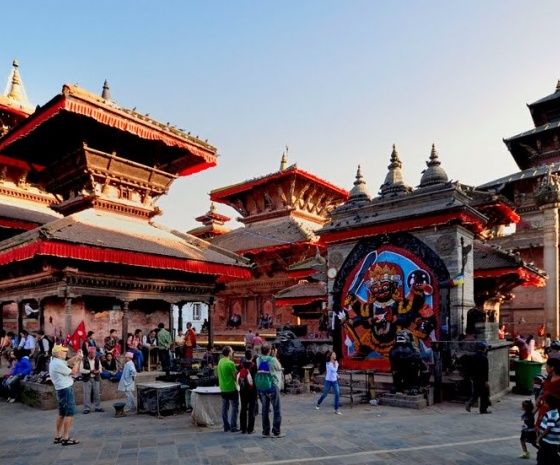 Fly to  Kathmandu & visit traditional market, streets & old durbar area in Rickshaw (B)